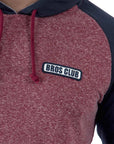 Imagen de acercamiento a sudadera manga rangla color mostaza con verde para hombre marca Bros Club