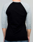Imagen de espalda playera manga larga lisa color negro con jaspe para mujer.